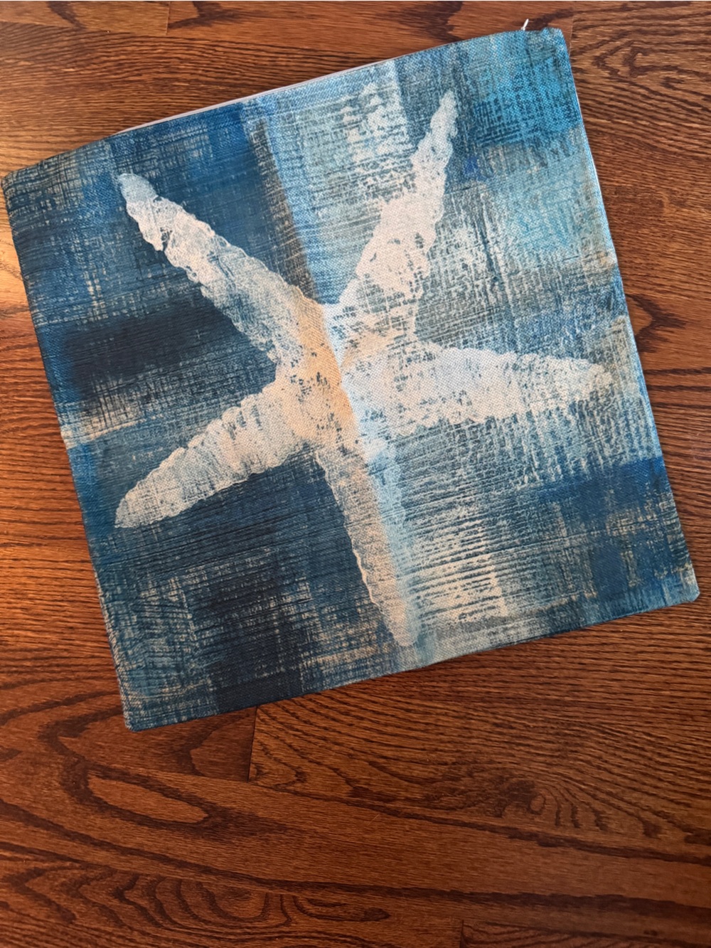 Print starfish pillow cover on teal-blue background 18x18